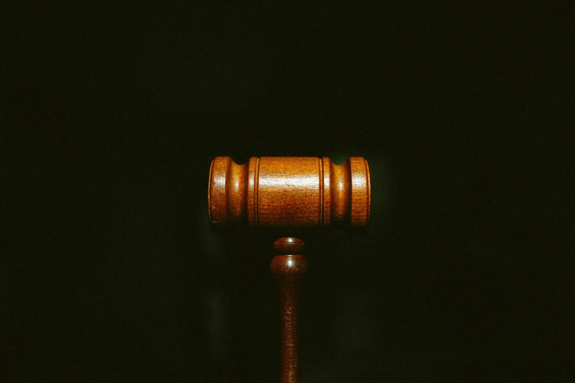 brown wooden stand with black background